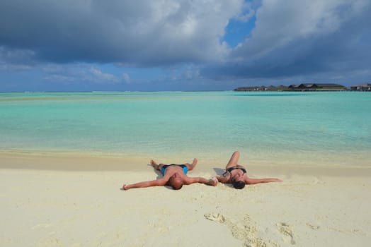 happy young romantic couple in love have fun running and relaxing on beautiful beach