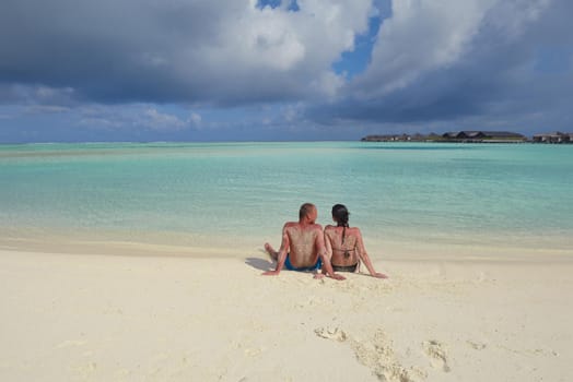 happy young romantic couple in love have fun running and relaxing on beautiful beach