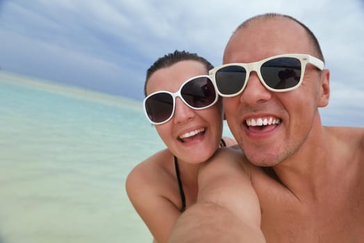 happy young romantic couple in love have fun running and relaxing on beautiful beach