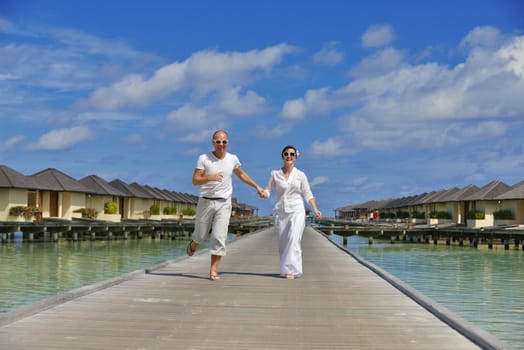 happy young  couple at summer vacation have fun and relax at beautiful sunny  day on beach