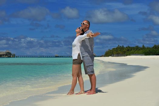 happy young romantic couple in love have fun running and relaxing on beautiful beach