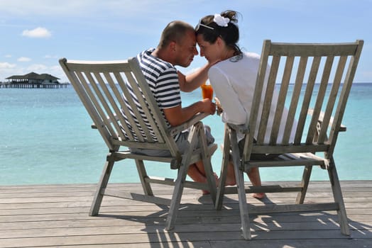 happy young couple relax and take fresh drink at summer vacation