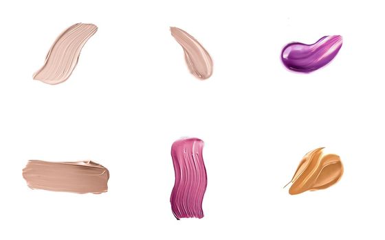 Set of art brush strokes or cosmetic makeup samples isolated on white background.