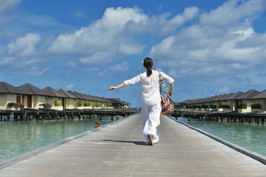 happy young woman on summer vacation on beautiful tropical beach have fun enjoy and relax