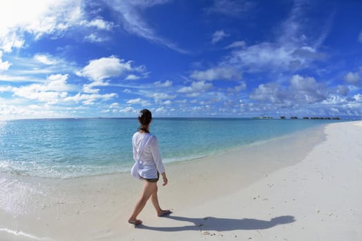 happy young woman on summer vacation on beautiful tropical beach have fun enjoy and relax