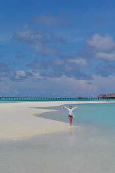 happy young woman on summer vacation on beautiful tropical beach have fun enjoy and relax