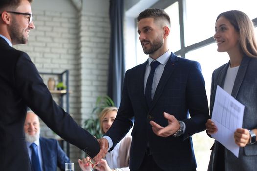 Business people shaking hands, finishing up a meeting