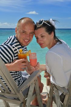 happy young couple relax and take fresh drink at summer vacation