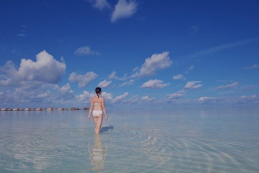 happy young woman on summer vacation on beautiful tropical beach have fun and relax