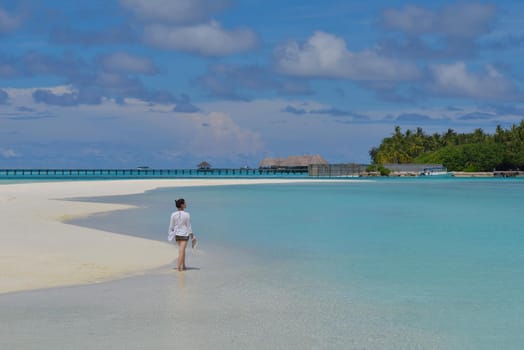 happy young woman on summer vacation on beautiful tropical beach have fun enjoy and relax