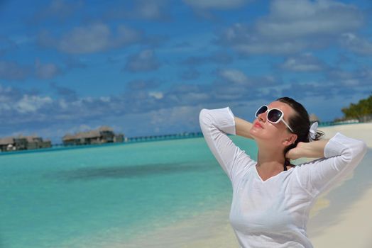 happy young woman on summer vacation on beautiful tropical beach have fun and relax