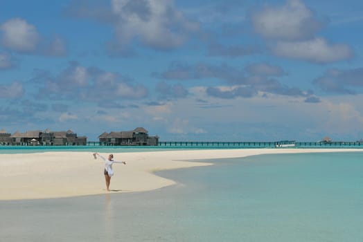 happy young woman on summer vacation on beautiful tropical beach have fun enjoy and relax