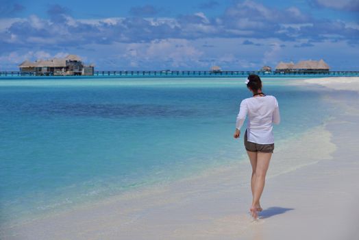 happy young woman on summer vacation on beautiful tropical beach have fun and relax