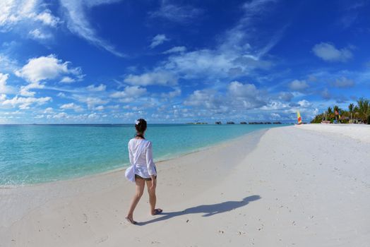 happy young woman on summer vacation on beautiful tropical beach have fun and relax