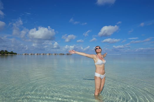 happy young woman on summer vacation on beautiful tropical beach have fun enjoy and relax