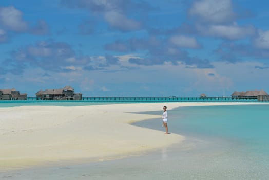 happy young woman on summer vacation on beautiful tropical beach have fun enjoy and relax