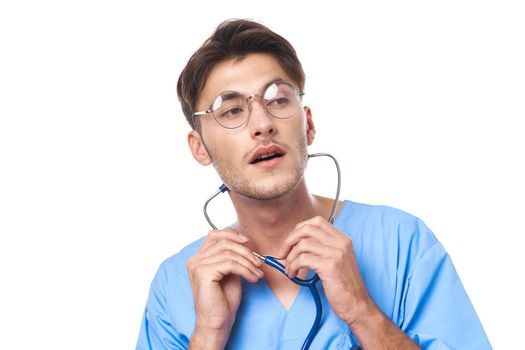 man in medical uniform wearing glasses stethoscope posing isolated background. High quality photo