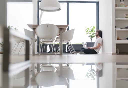 Real man Using laptop on the floor At Home  Enjoying Relaxing