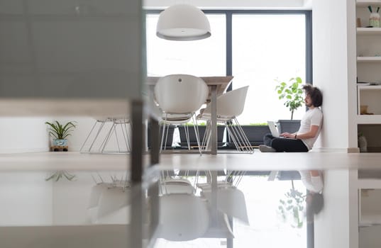 Real man Using laptop on the floor At Home  Enjoying Relaxing