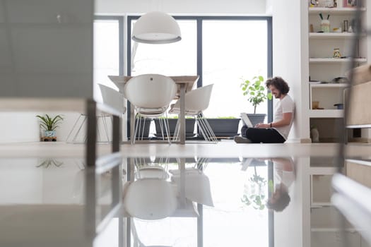 Real man Using laptop on the floor At Home  Enjoying Relaxing