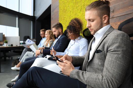 Modern business people waiting for job interview.