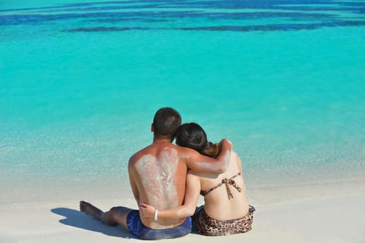 happy young asian couple have fun and romantic time at  summer on beautiful white sand beach