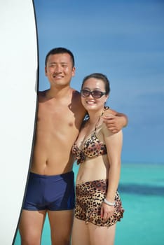 happy young asian couple have fun and romantic time at  summer on beautiful white sand beach