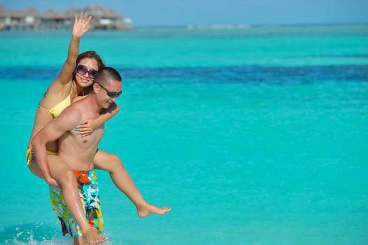 happy young asian couple have fun and romantic time at  summer on beautiful white sand beach