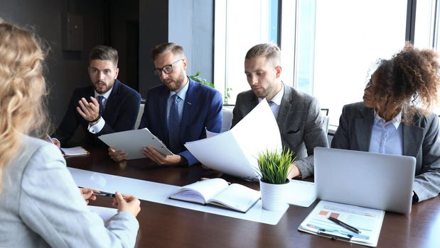 Job interview with the employer, businessman listen to candidate answers