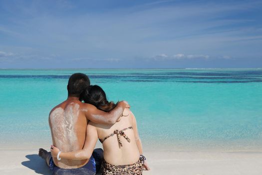 happy young asian couple enjoying summer and have on beautiful white sand beach