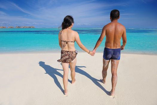 happy young asian couple have fun and romantic time at  summer on beautiful white sand beach