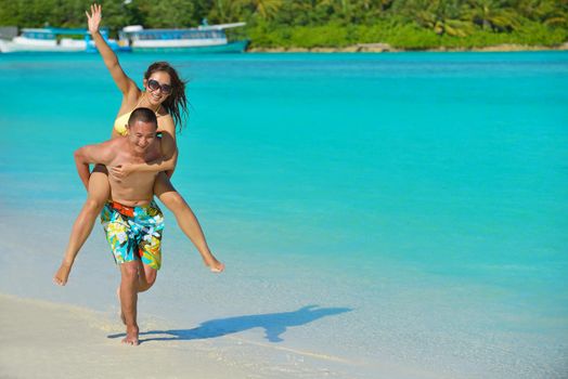 happy young asian couple have fun and romantic time at  summer on beautiful white sand beach