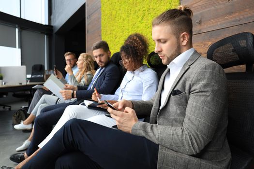 Modern business people waiting for job interview.
