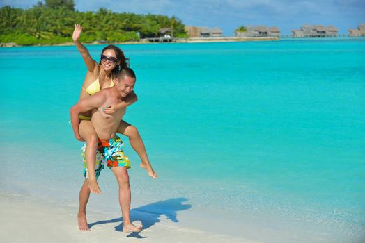 happy young asian couple have fun and romantic time at  summer on beautiful white sand beach