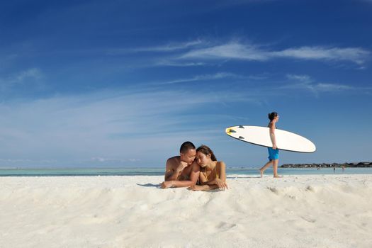 happy young asian couple enjoying summer and have on beautiful white sand beach