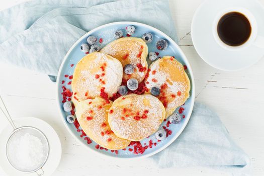 Fluffy japanese pancake, thick souffle. Trendy food. Delicious Breakfast on a white background. Top view