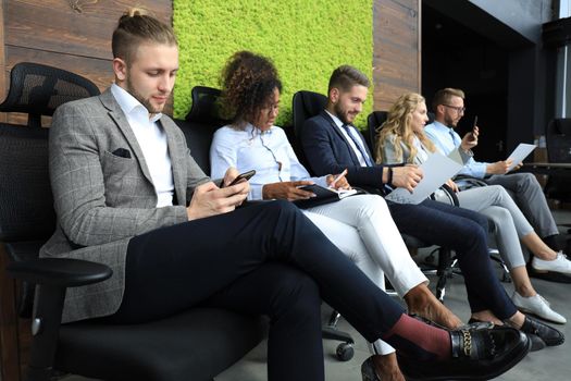 Modern business people waiting for job interview.