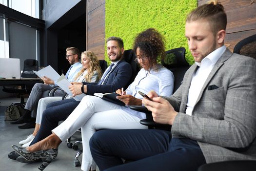 Modern business people waiting for job interview.