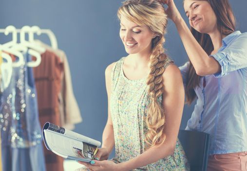 Young woman hairdresser do hairstyle girl in salon .