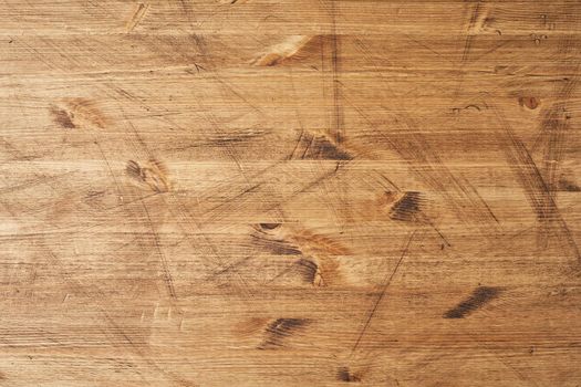 Rustic old dark wooden background with pine wood, structure of wood with knots. Beige brown textured background pattern. Natural rustic hardwood, closeup, top view. Wooden backdrop, table. Copy space