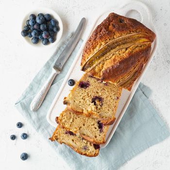 Homemade Banana bread. Baked cake. Top view, white table. Traditional american cuisine. Slice of loaf.