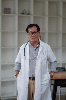 Portrait asian male senior doctor hospital medical clinic medicine health care