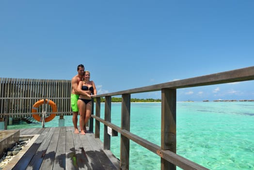 happy young  couple at summer vacation have fun and relax at beautiful sunny  day on beach