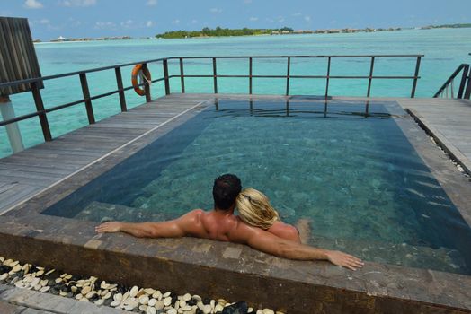 happy young  couple at summer vacation have fun and relax at beautiful sunny  day on beach