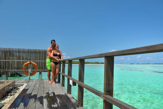 happy young  couple at summer vacation have fun and relax at beautiful sunny  day on beach