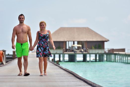 happy young  couple at summer vacation have fun and relax at beautiful sunny  day on beach