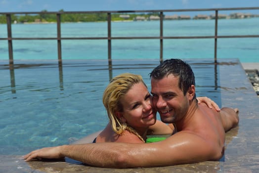 happy young  couple at summer vacation have fun and relax at beautiful sunny  day on beach