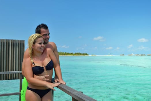 happy young  couple at summer vacation have fun and relax at beautiful sunny  day on beach