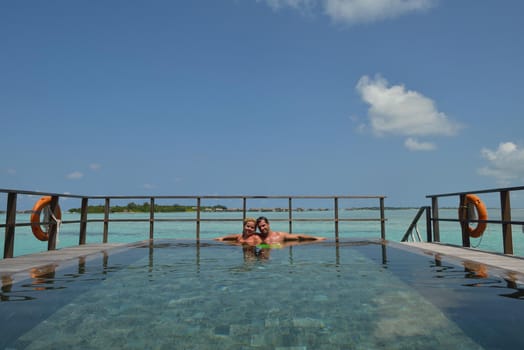 happy young  couple at summer vacation have fun and relax at beautiful sunny  day on beach