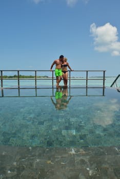 happy young  couple at summer vacation have fun and relax at beautiful sunny  day on beach